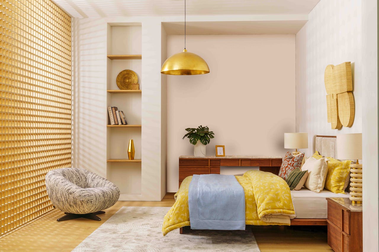 Elegant bedroom design featuring gold, yellow, and blue decor in the UAE.